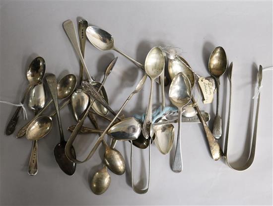 A collection of silver and white metal flatware, including sets of spoons, sugar tongs, etc.